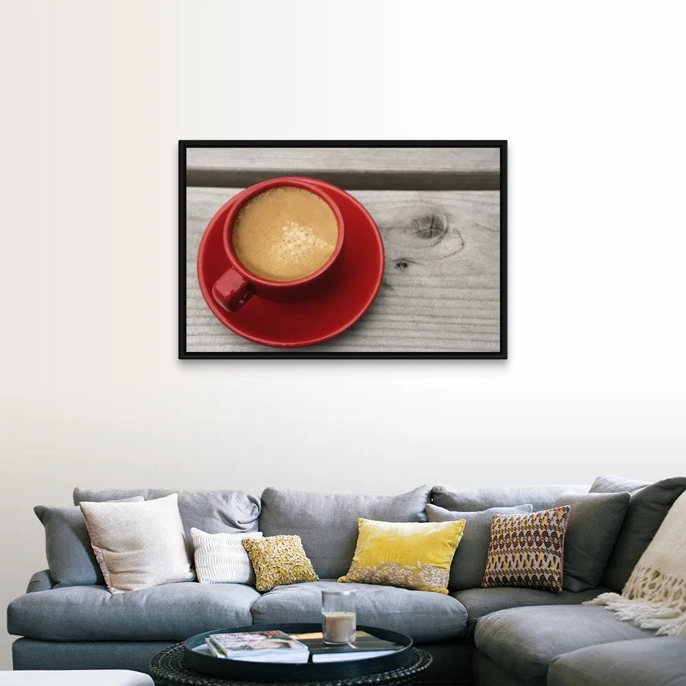 "A bright red cup of espresso coffee on a picnic table outdoors on a summer day." Black Float Frame Canvas Art